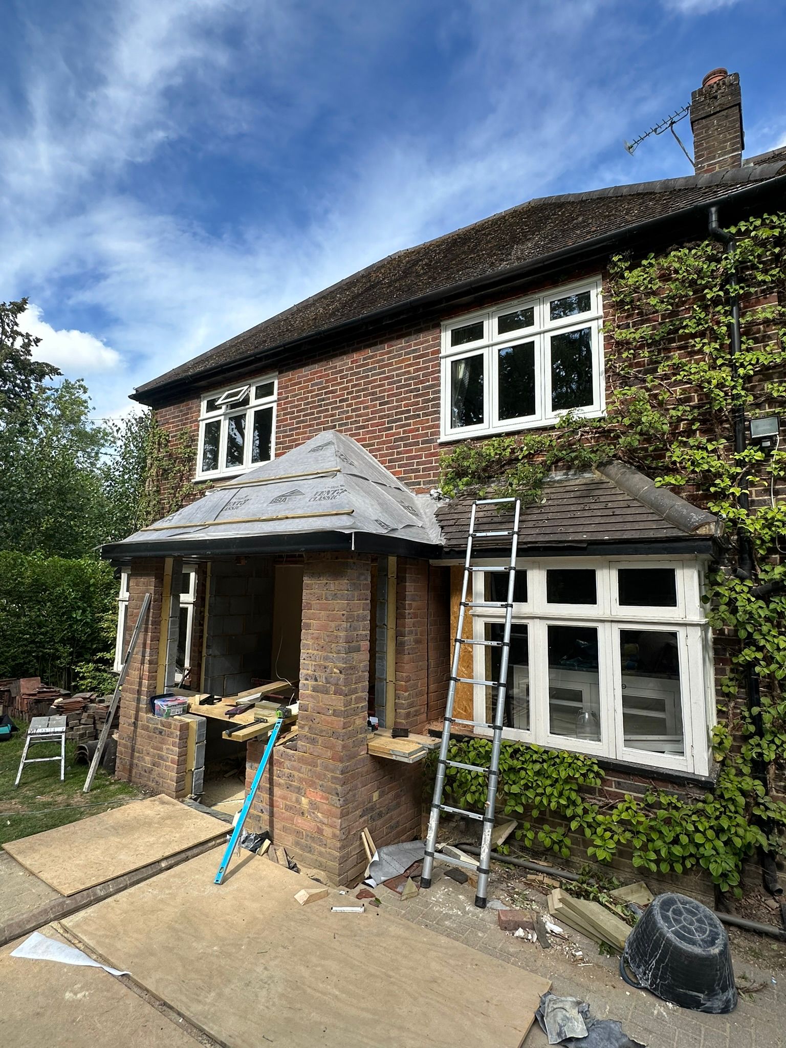 Rear extension and large front porch project in progress in Chiddingfold