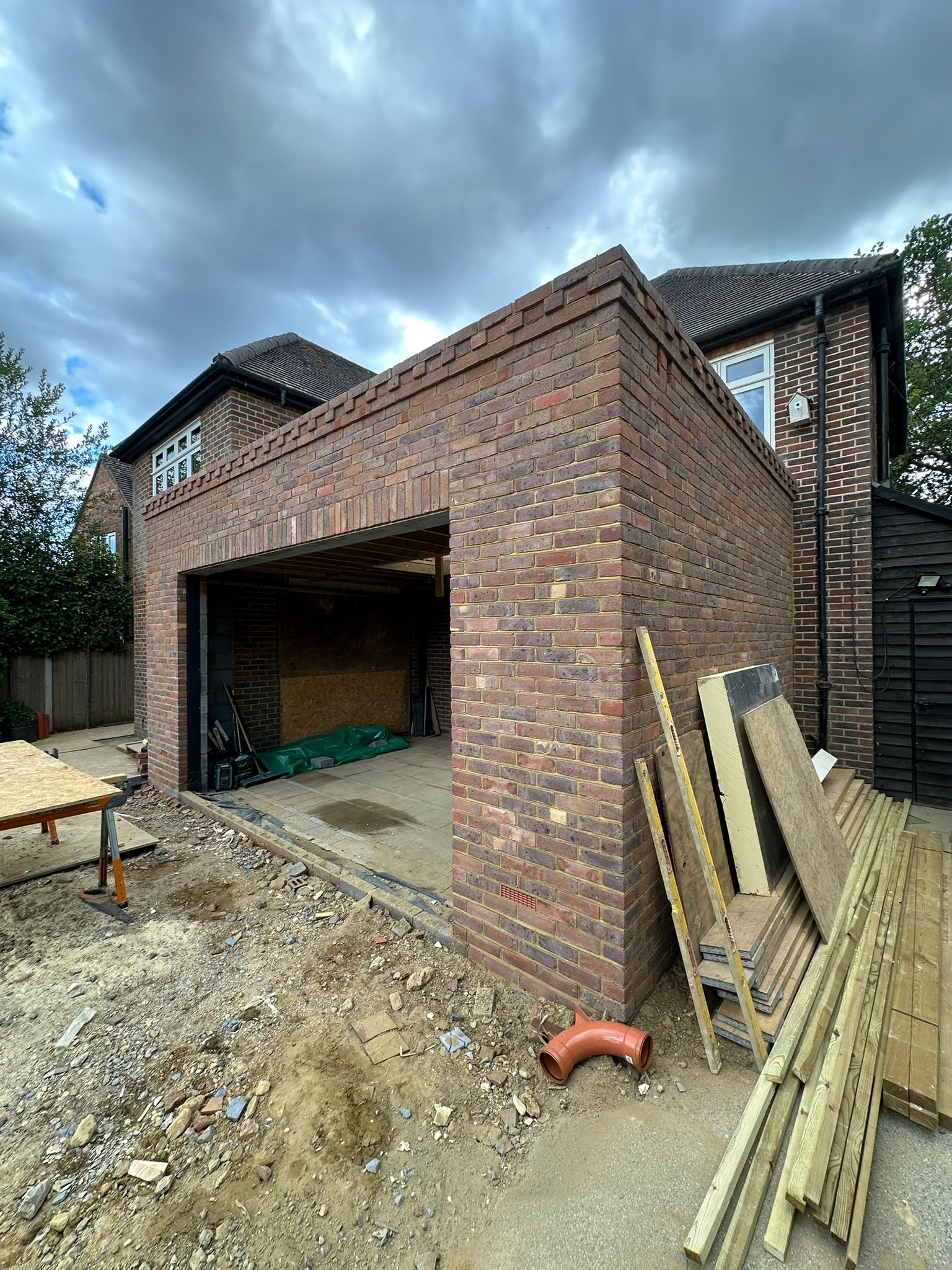Rear extension and large front porch project in progress in Chiddingfold