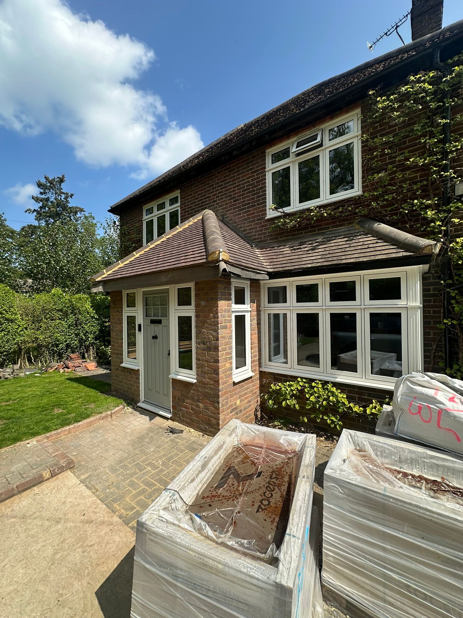 Rear extension and large front porch project in progress in Chiddingfold