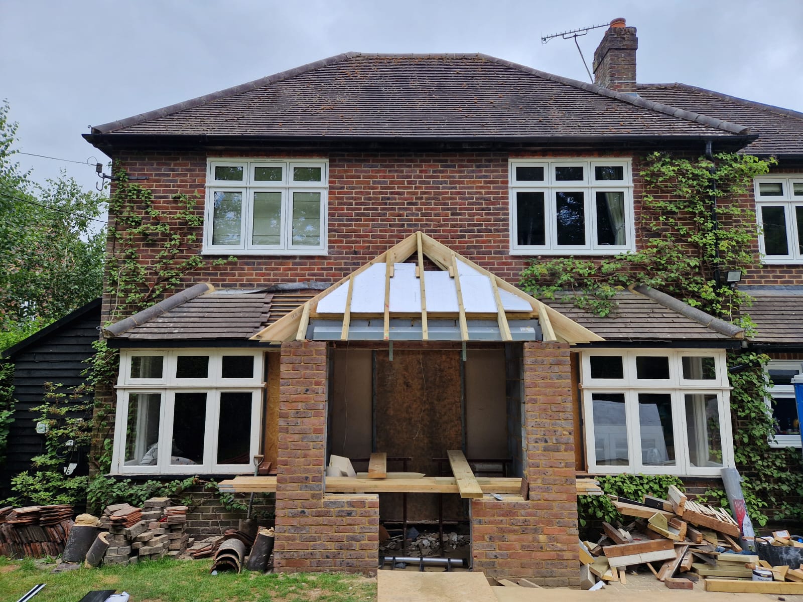 Rear extension and large front porch project in progress in Chiddingfold