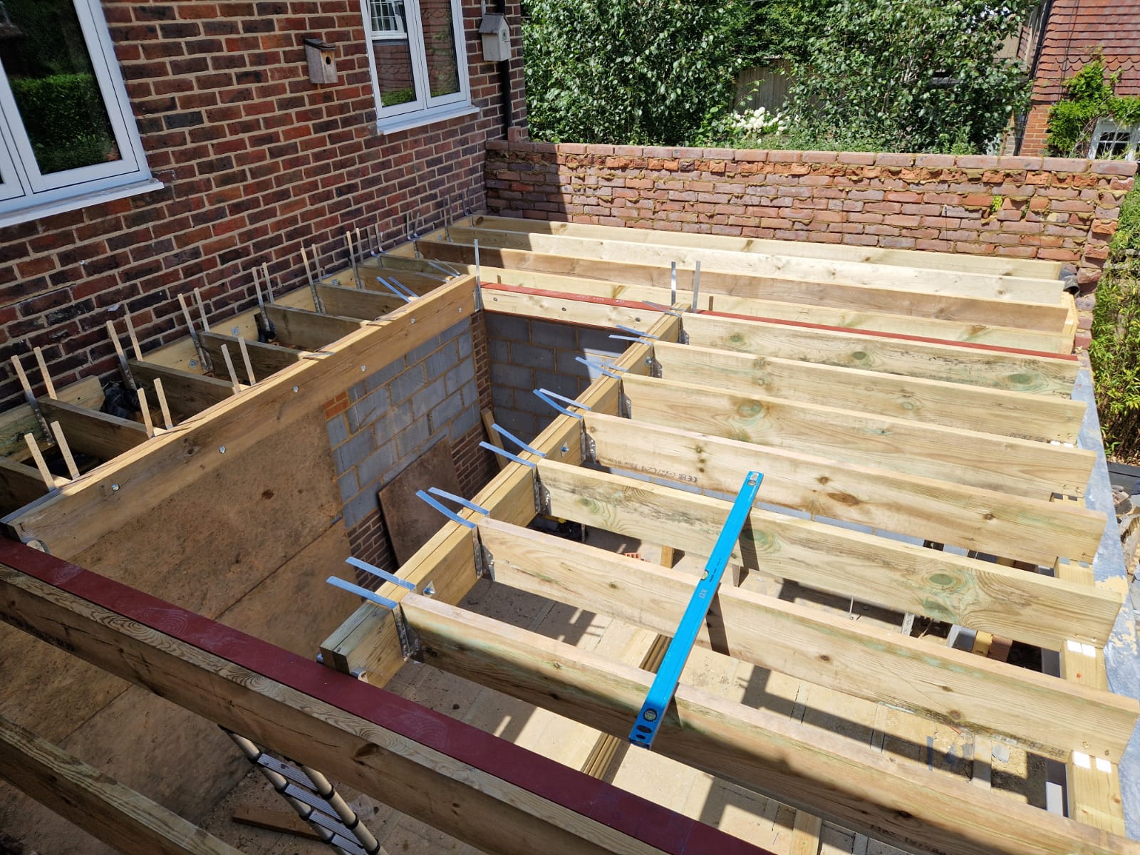 Rear extension and large front porch project in progress in Chiddingfold